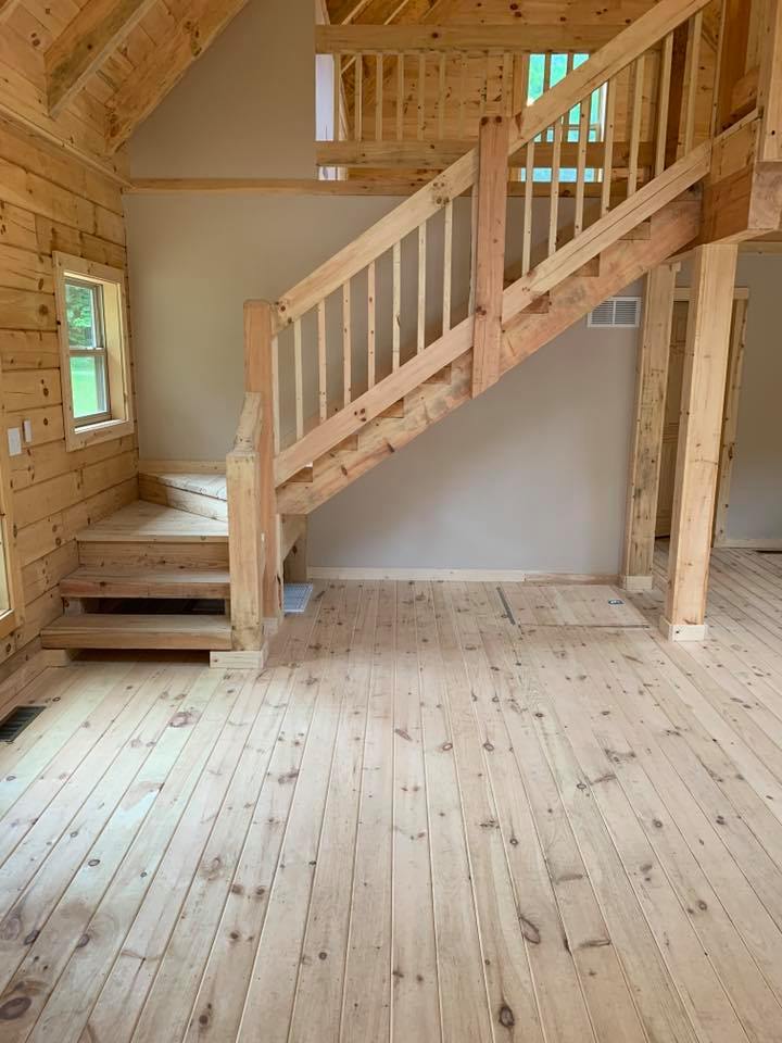 Wooden interior with staircase and natural light.
