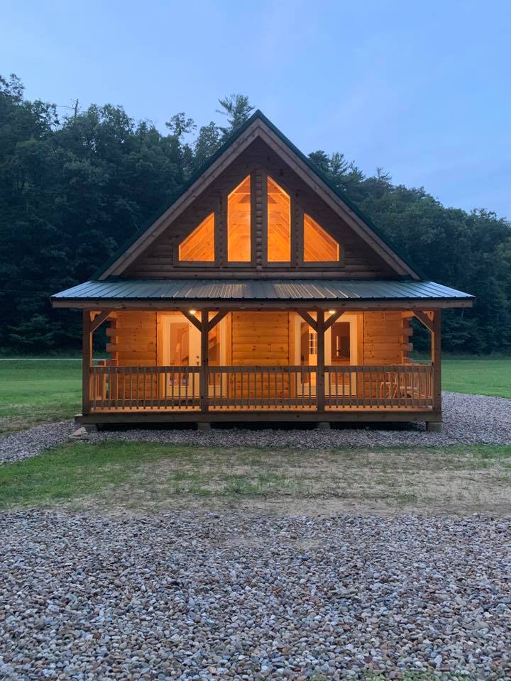 Cozy cabin with lights in the evening.