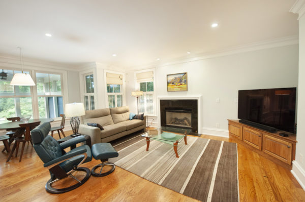 Modern living room with fireplace and TV.