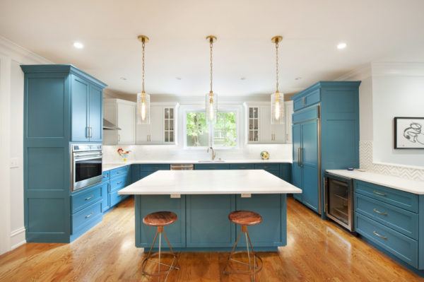 Modern kitchen with blue cabinets and island.