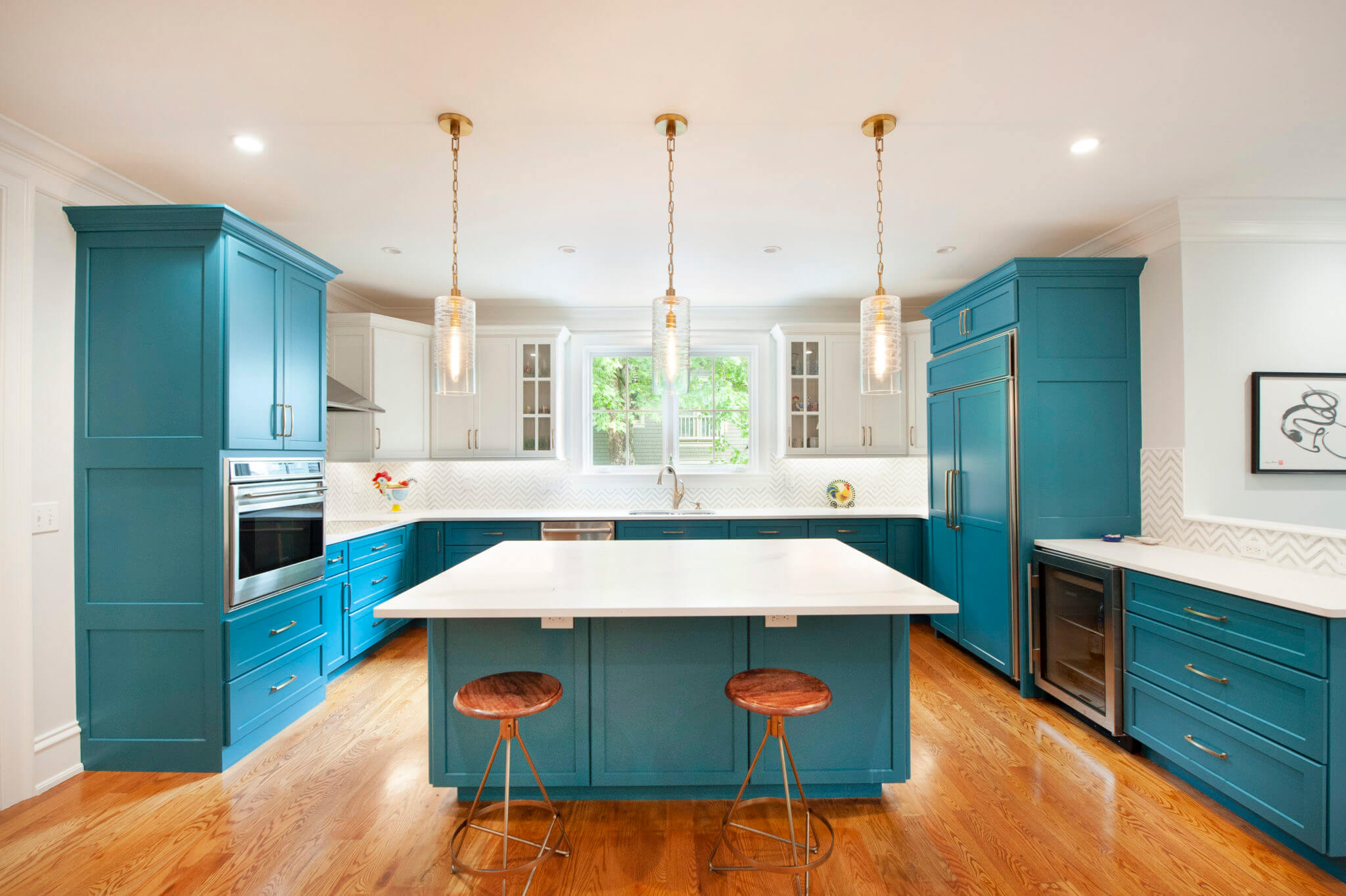 Modern kitchen with blue cabinets and island.