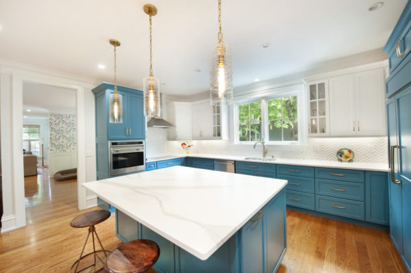 Modern kitchen with blue cabinets and island.