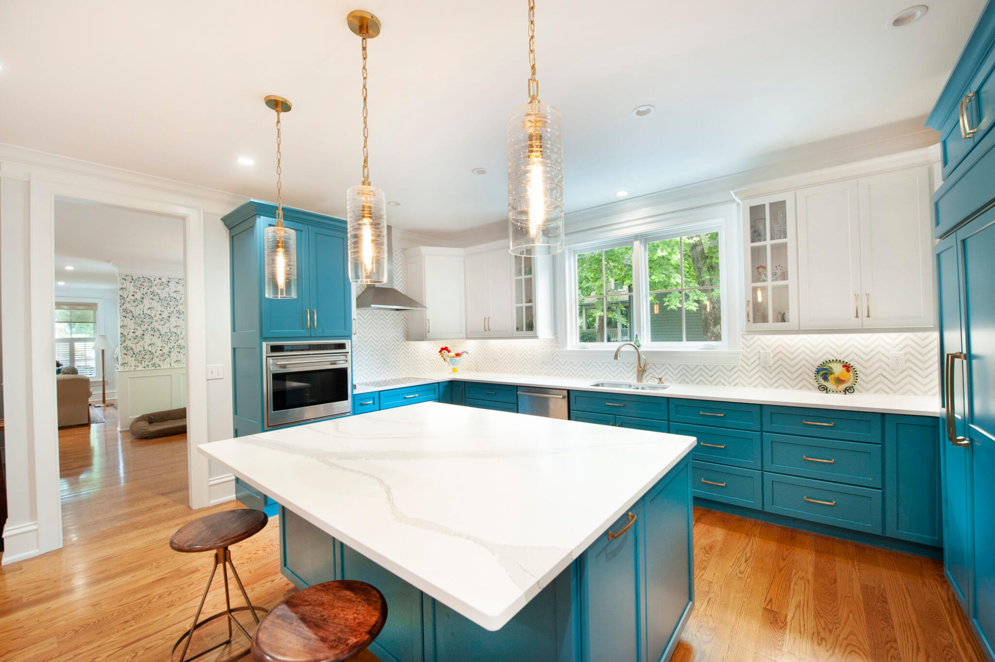 Modern kitchen with blue cabinets and island.