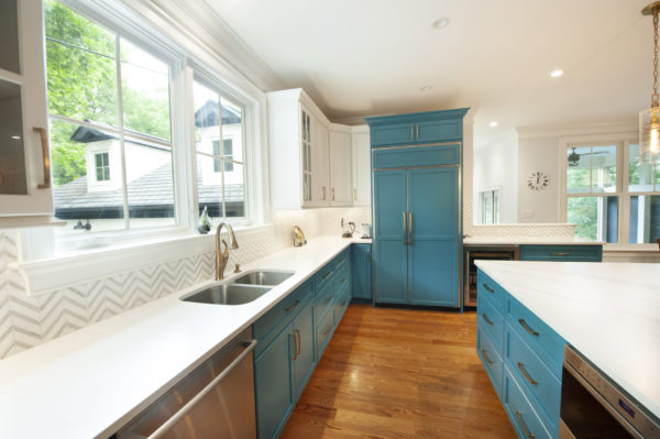 Modern kitchen with blue cabinets and island.