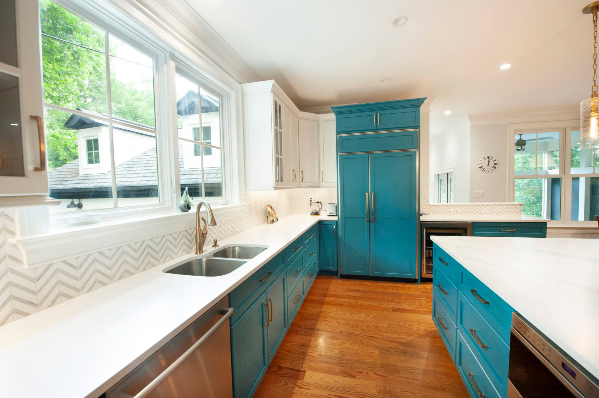 Modern kitchen with blue cabinets and island.
