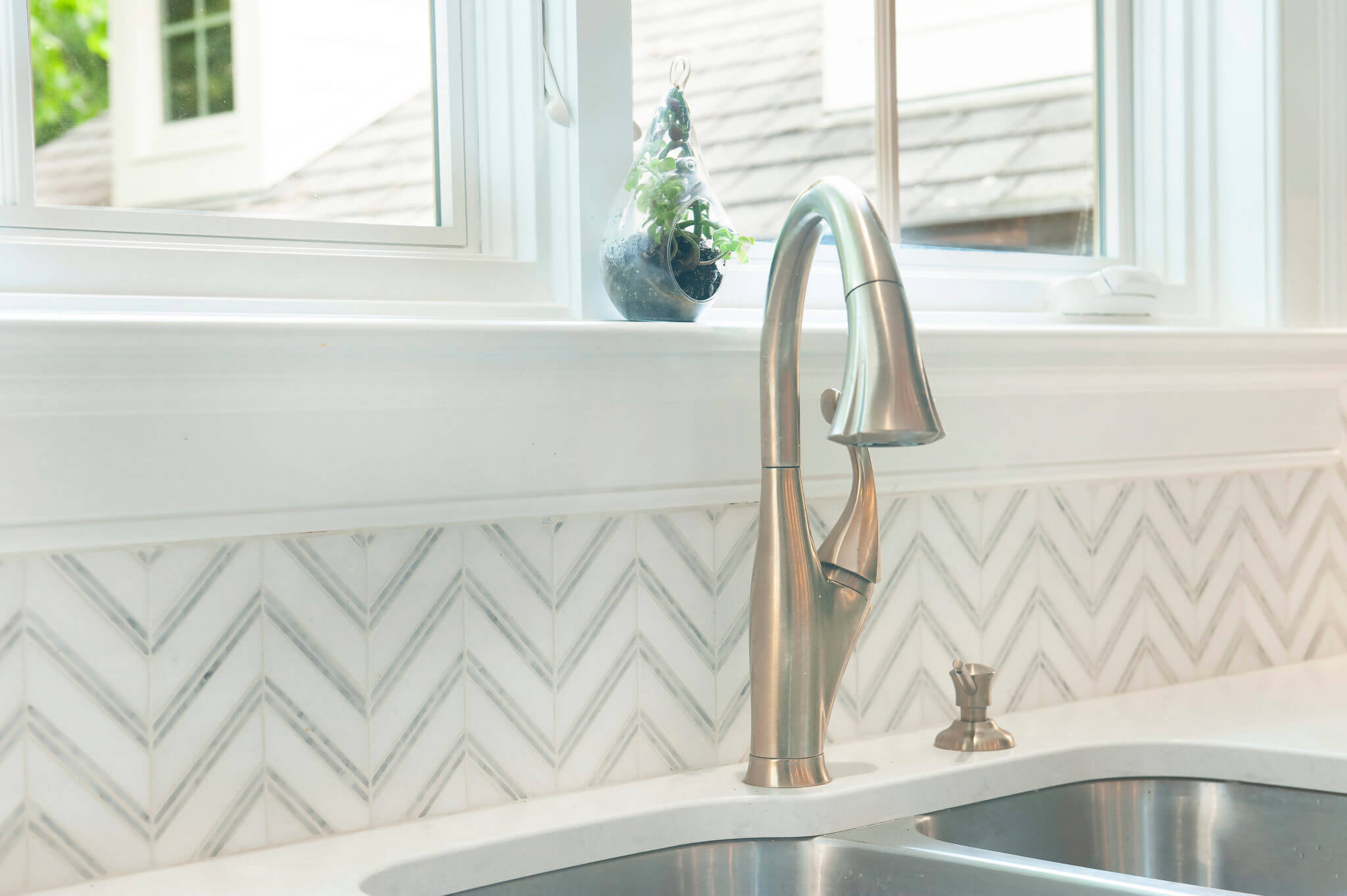 Modern kitchen sink with stylish faucet.