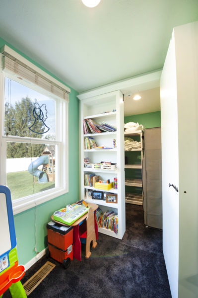 Children's playroom with books and toys.