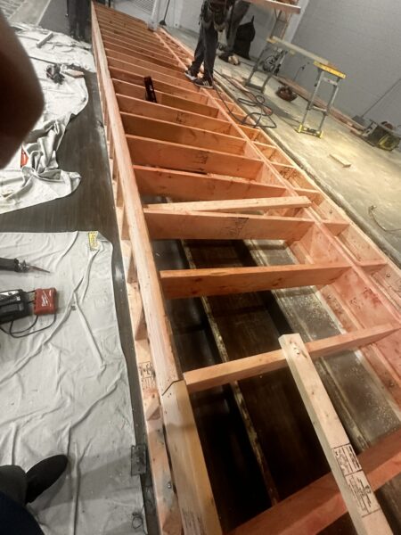 Wooden framework under construction in a workshop.